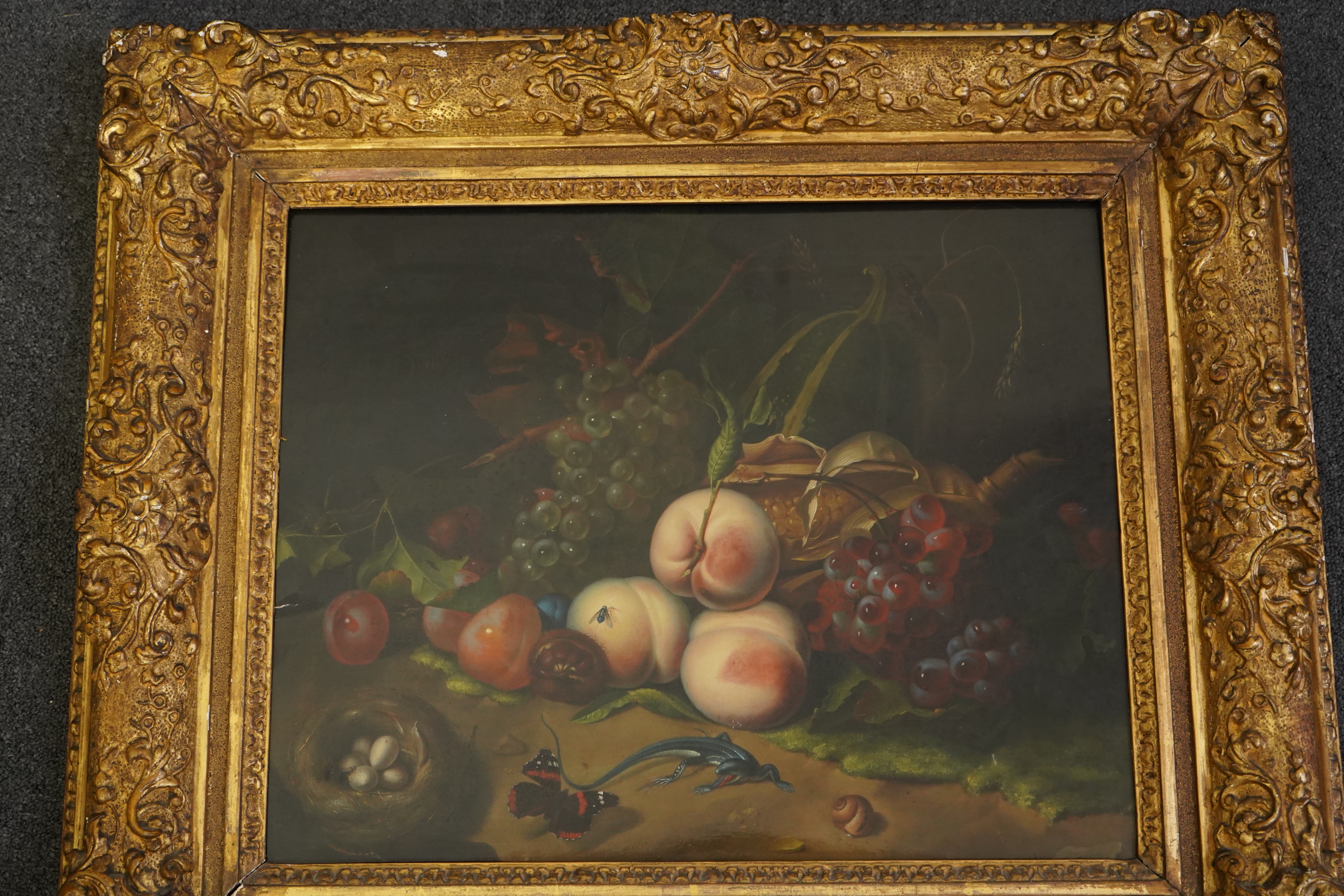 Circle of Rachel Ruysch (Dutch, 1664-1750), Still life of fruit with a lizard, bird's nest and butterfly, oil on wooden panel, 41 x 51cm